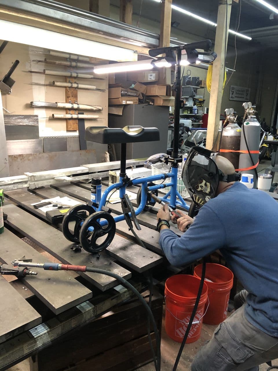 Blue bike frame welding shop in progress — Naples Welding Inc., Naples FL