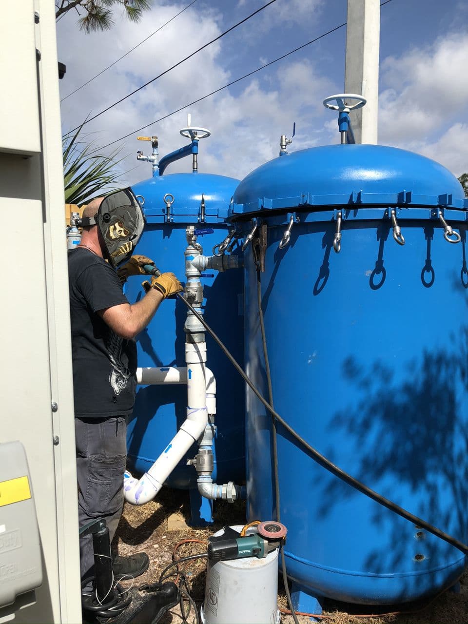 Blue tank structure welding in progress outdoors — Naples Welding Inc., Naples FL