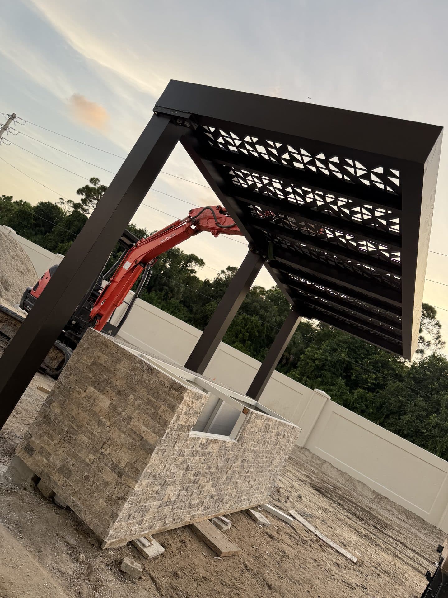 Structural frame and columns of a custom fabricated metal pergola during installation — Naples Welding Inc., Naples FL
