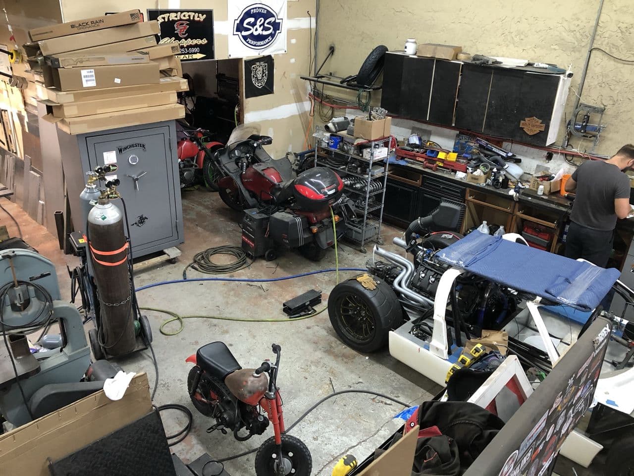Motorcycle engine repair workshop in progress — Naples Welding Inc., Naples FL