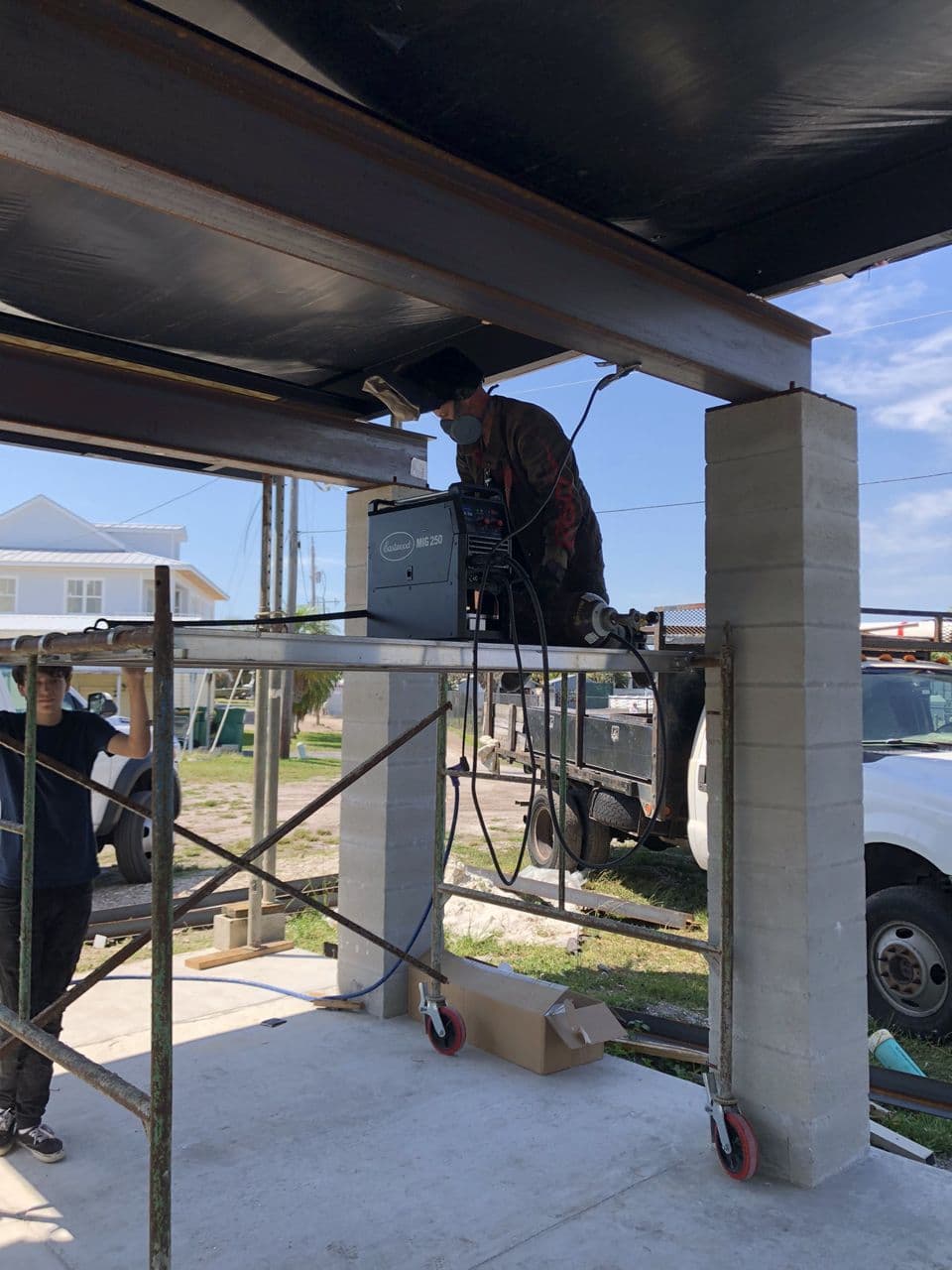 Structural steel beam welding in progress outdoors — Naples Welding Inc., Naples FL