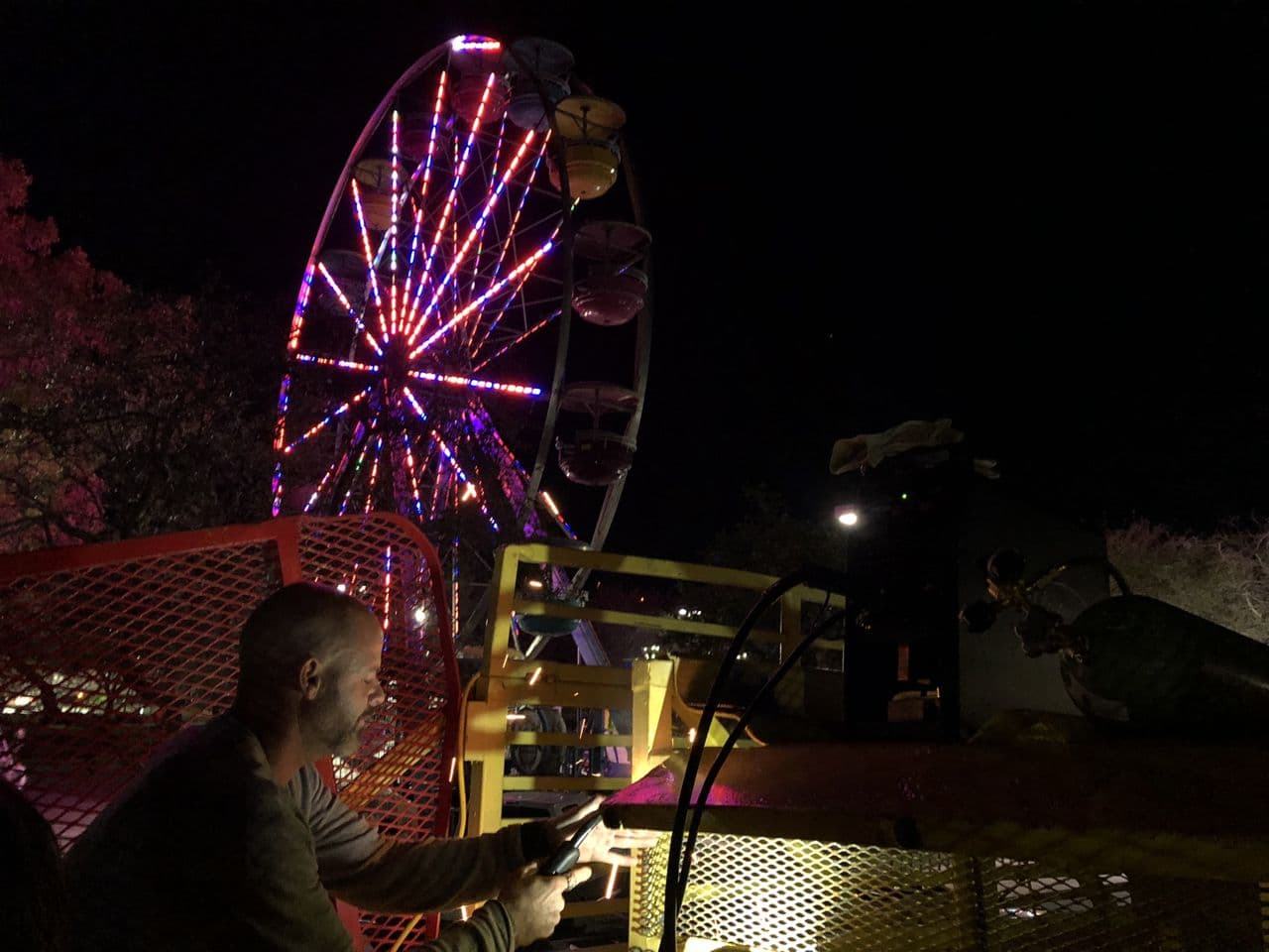 Structural steel ferris wheel in progress night — Naples Welding Inc., Naples FL