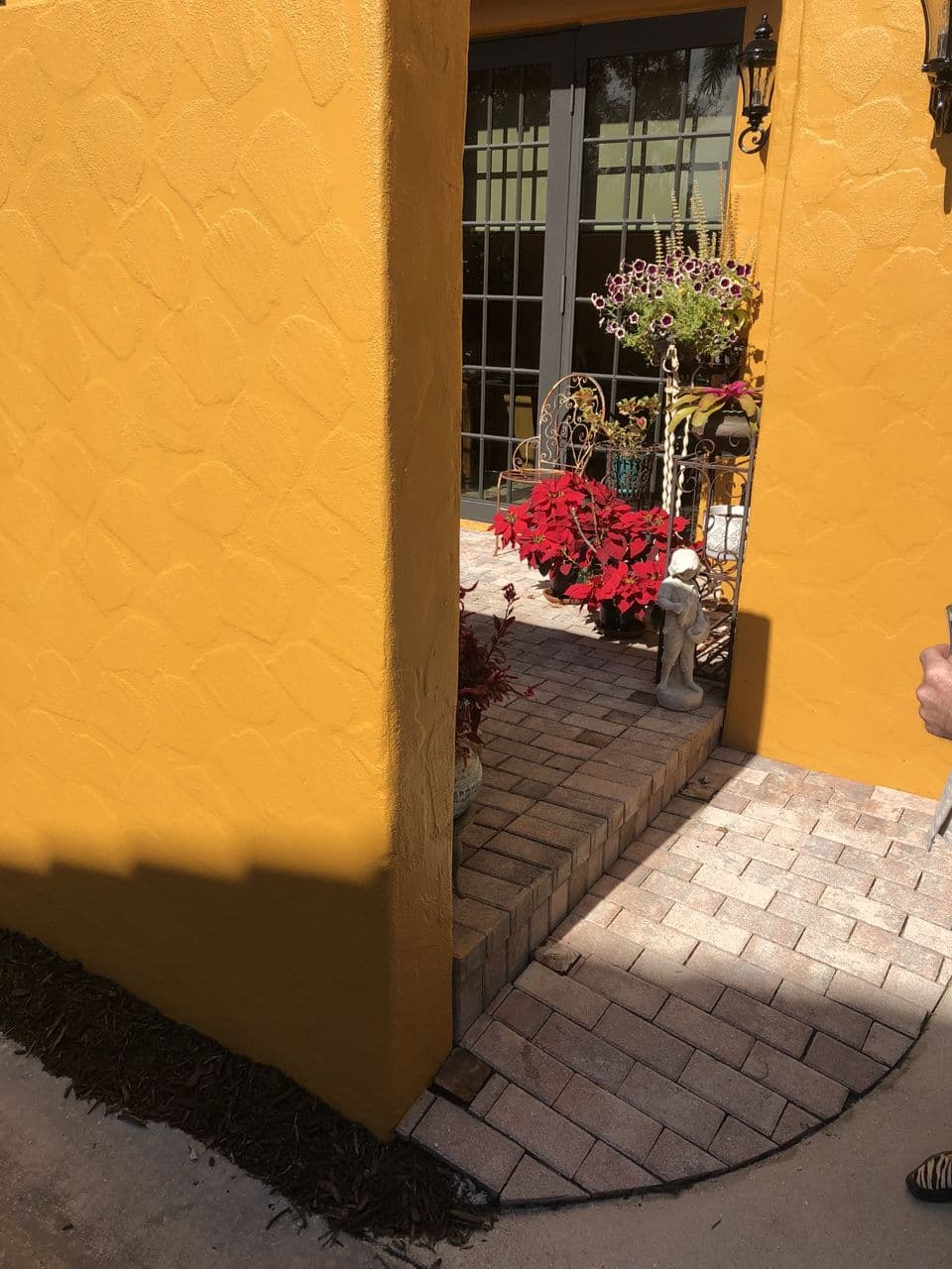 Yellow paint patio stairs detail shot — Naples Welding Inc., Naples FL